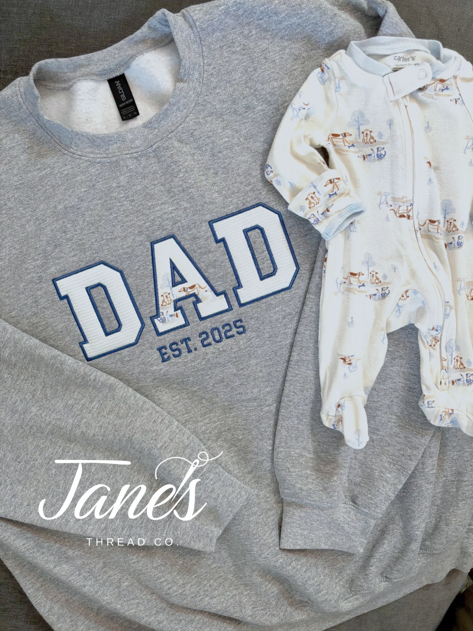 DAD text on a grey sweatshirt made from embroidered baby outfits