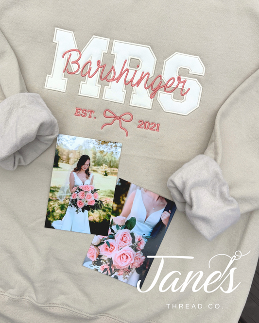 Beige sweatshirt with 'MRS. Barshinger EST. 2021' text and photos of a bride and groom.